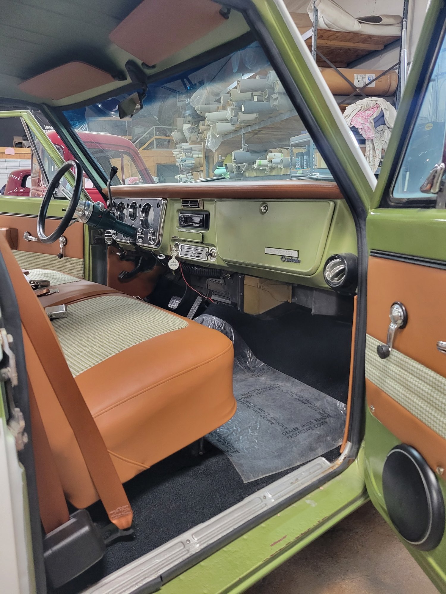 Completed tan and houndstooth interior in a green classic Chevrolet truck