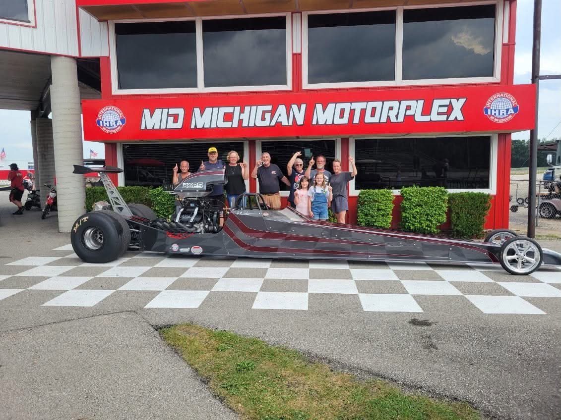Jim Thurston with his dragster and racing group at Mid Michigan Motorplex