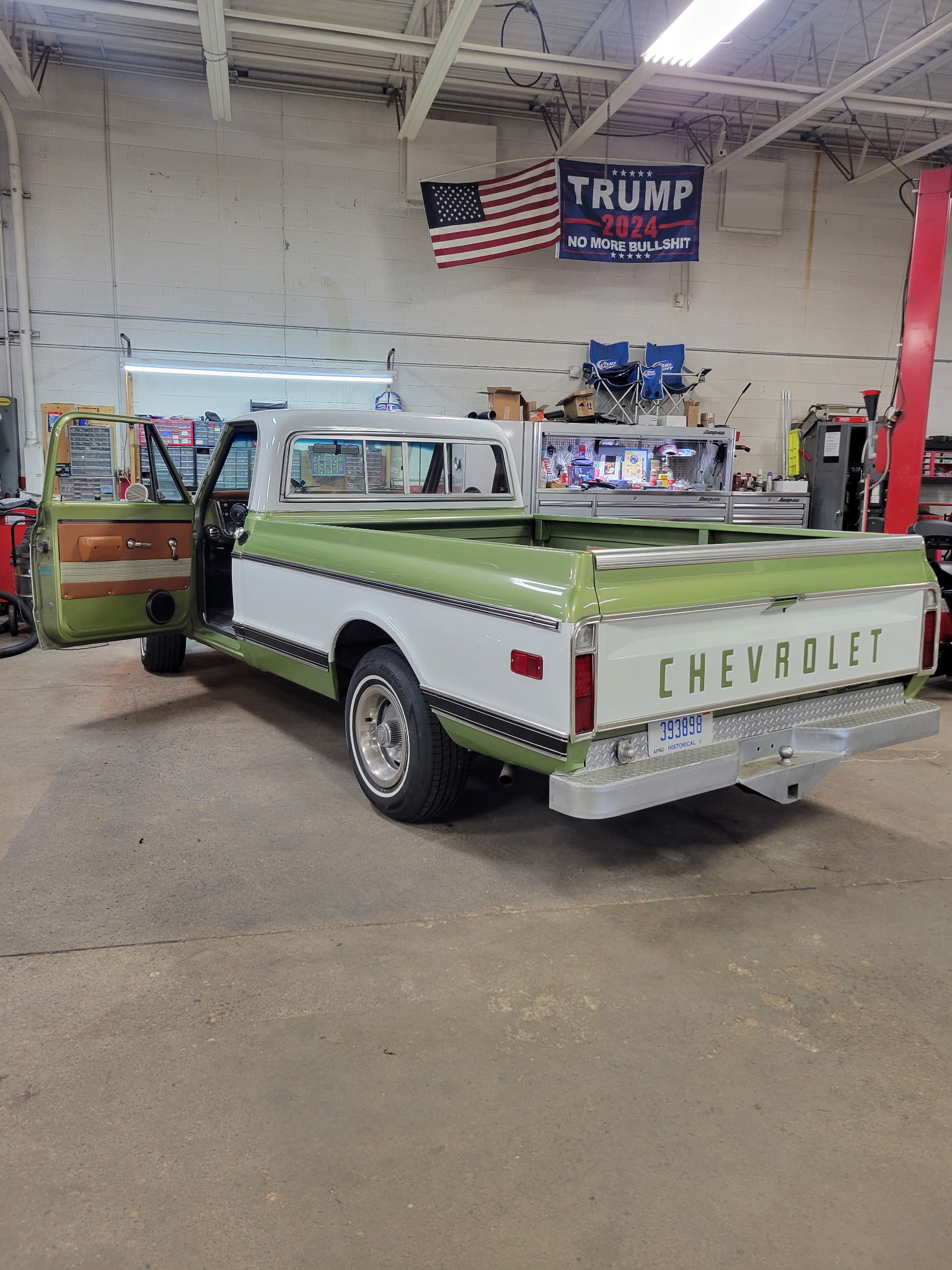Completed green and white classic Chevrolet pickup in the Holland shop