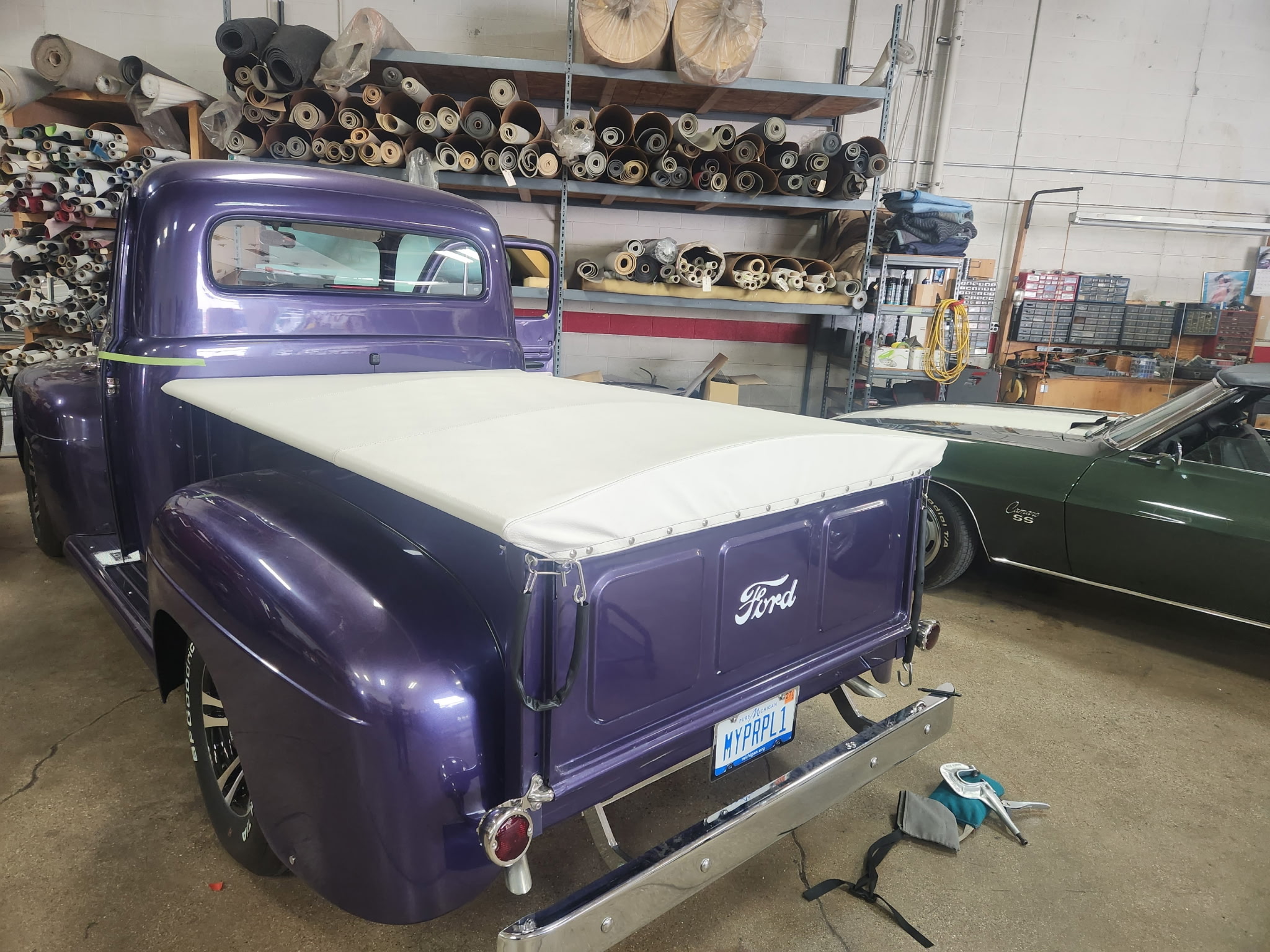 White fitted bed cover on a purple classic Ford pickup